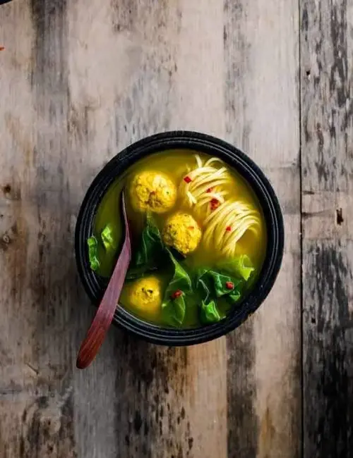 A flavourful, healing bone broth with turmeric and ginger for extra warmth and wellness.