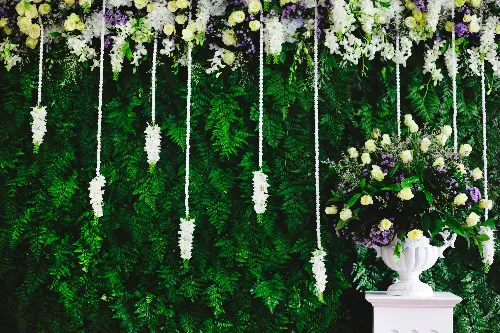 The gradient flower wall is made visually interesting with trailing vines.