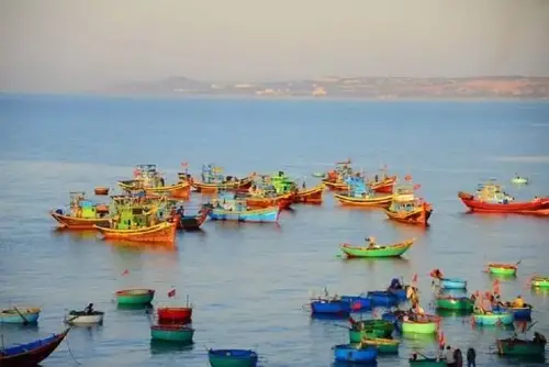 Colorful fishing boats at sea.