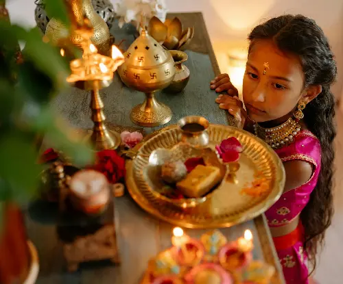 Deepavali: Rekindling the Spark - Little girl by altar